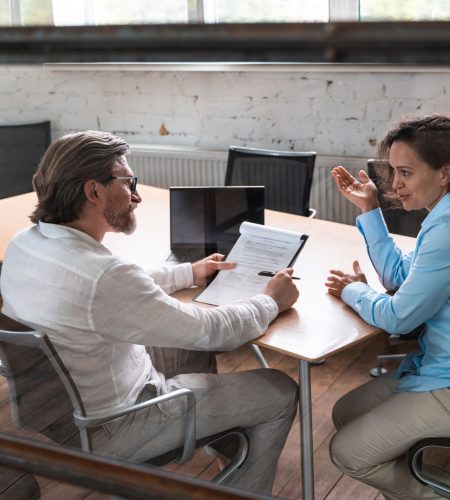 start up business team in the office. Recruiter and woman on a job interview